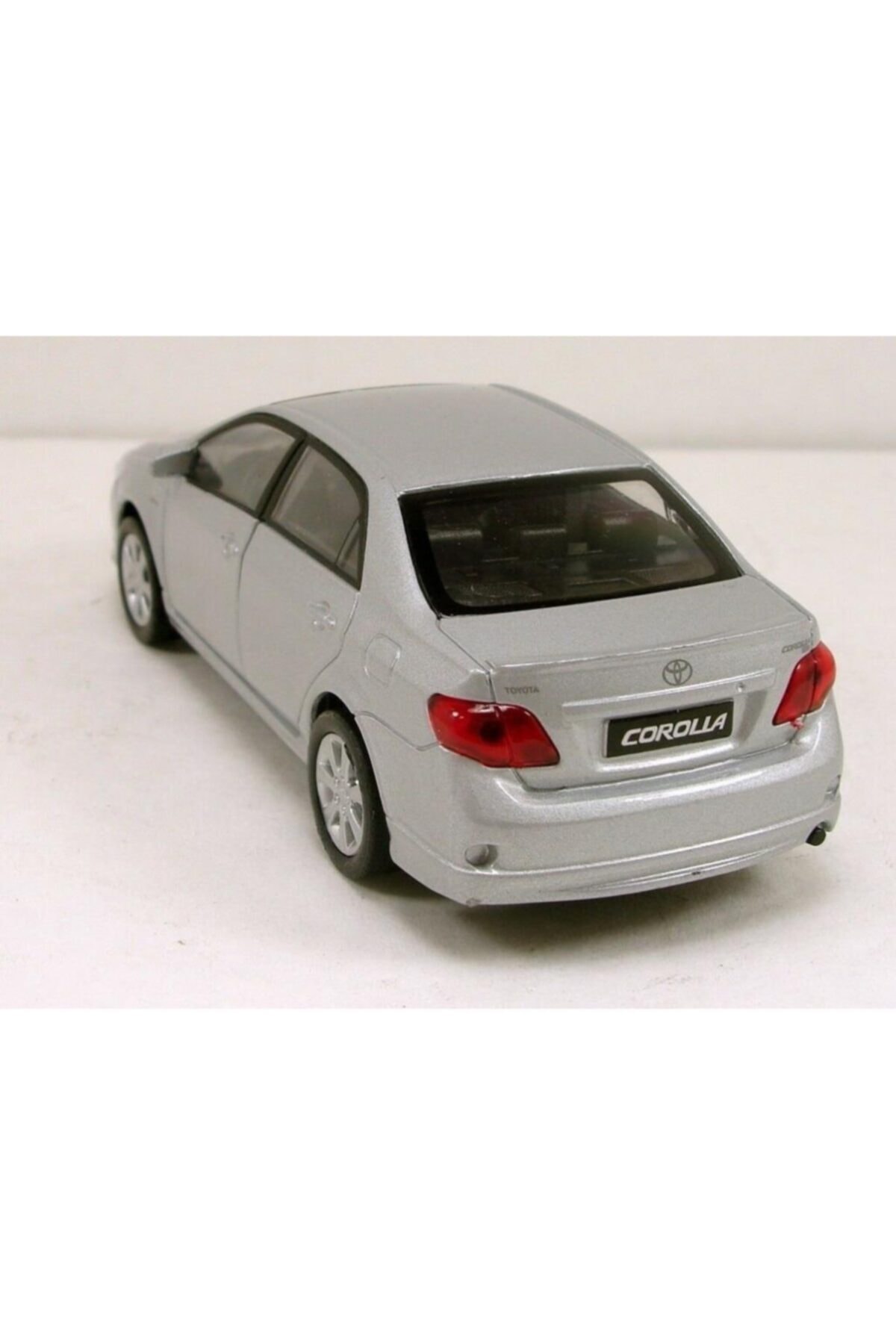 ماشین اسباب بازی TOYOTA COROLLA 1 36 SCALE PULL & DROP مدل فلزی TOY CAR GREY 2009 Welly Metal
