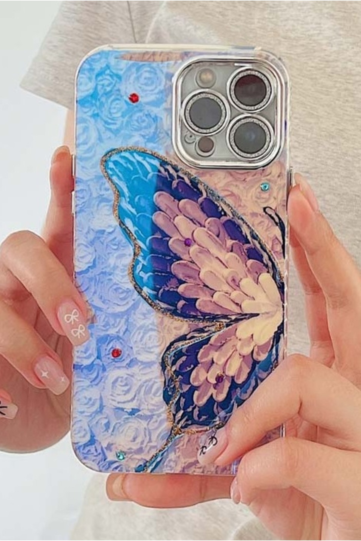 کاور و قاب محافظ لنز دوربین سنگی TRANSITION COLOR CASE IPHONE 16 PRO MAX ضربه گیر با طرح پروانه بنفش نقره ای فیبکس Fibaks