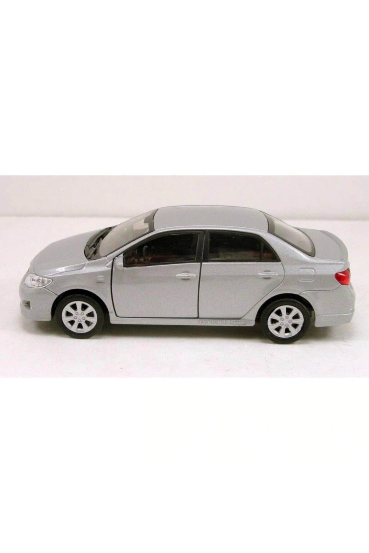 ماشین اسباب بازی TOYOTA COROLLA 1 36 SCALE PULL & DROP مدل فلزی TOY CAR GREY 2009 Welly Metal