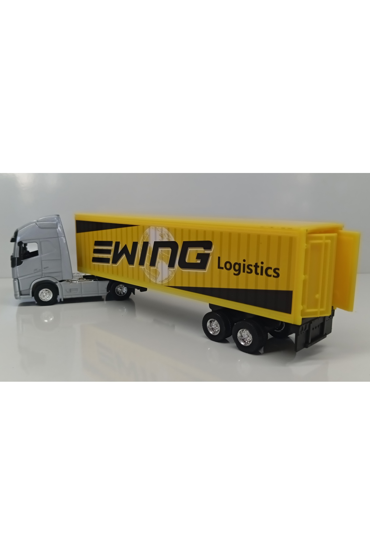 مدل خودرو DIANOMI WELLY در مقیاس 1:64 VOLVO FH TRAILER سایز کوچک اورجینال WELLY