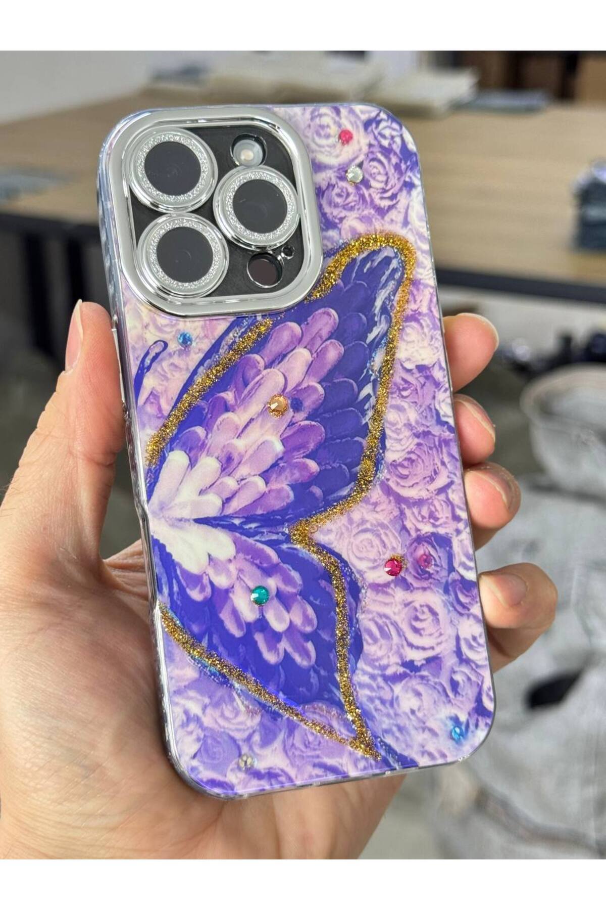 کاور و قاب محافظ لنز دوربین سنگی TRANSITION COLOR CASE IPHONE 16 PRO MAX ضربه گیر با طرح پروانه بنفش نقره ای فیبکس Fibaks